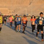 Runners running in luxor the Egyptian Marathon