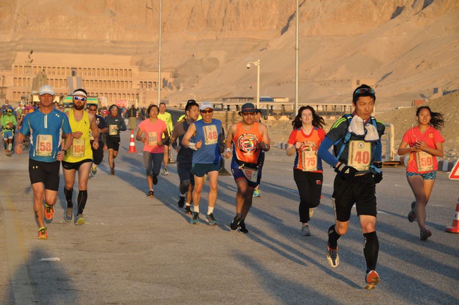 Runners running in luxor the Egyptian Marathon