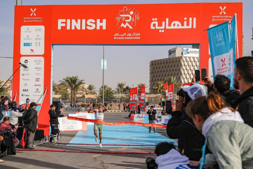 a guy nearing the finish of the Riyadh Marathon