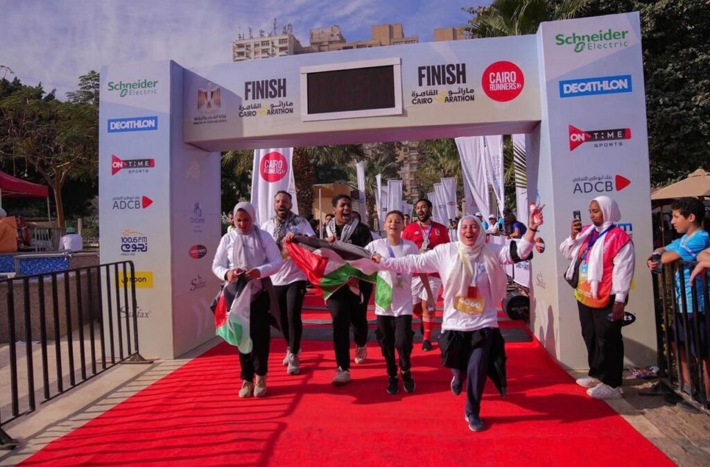 Participants crossing the finish line in the Cairo Half Marathon