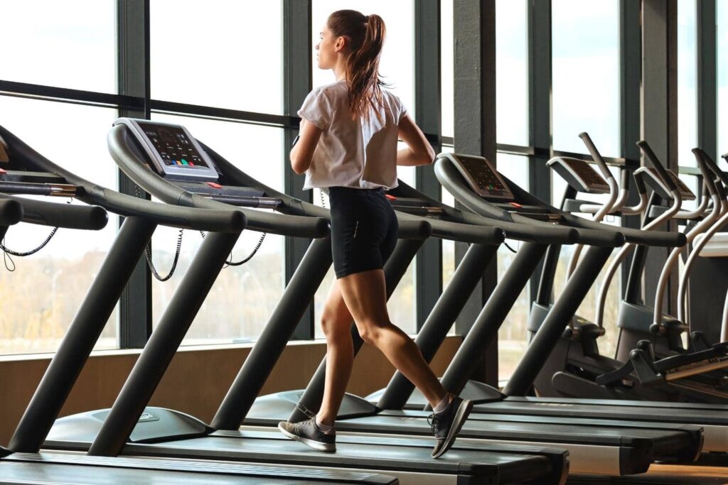 A woman running on a treadmill.