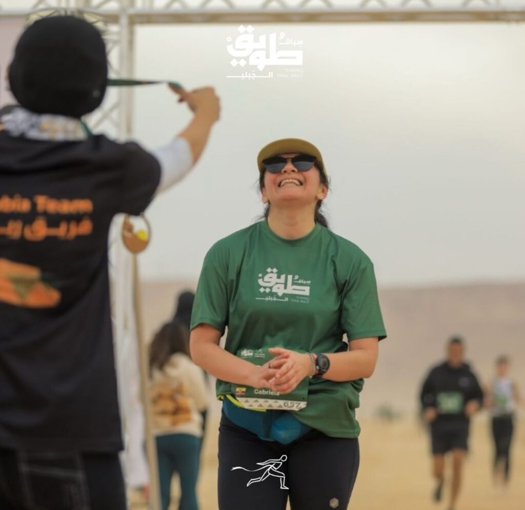 Female runner at the finish line of Tawiq trail race