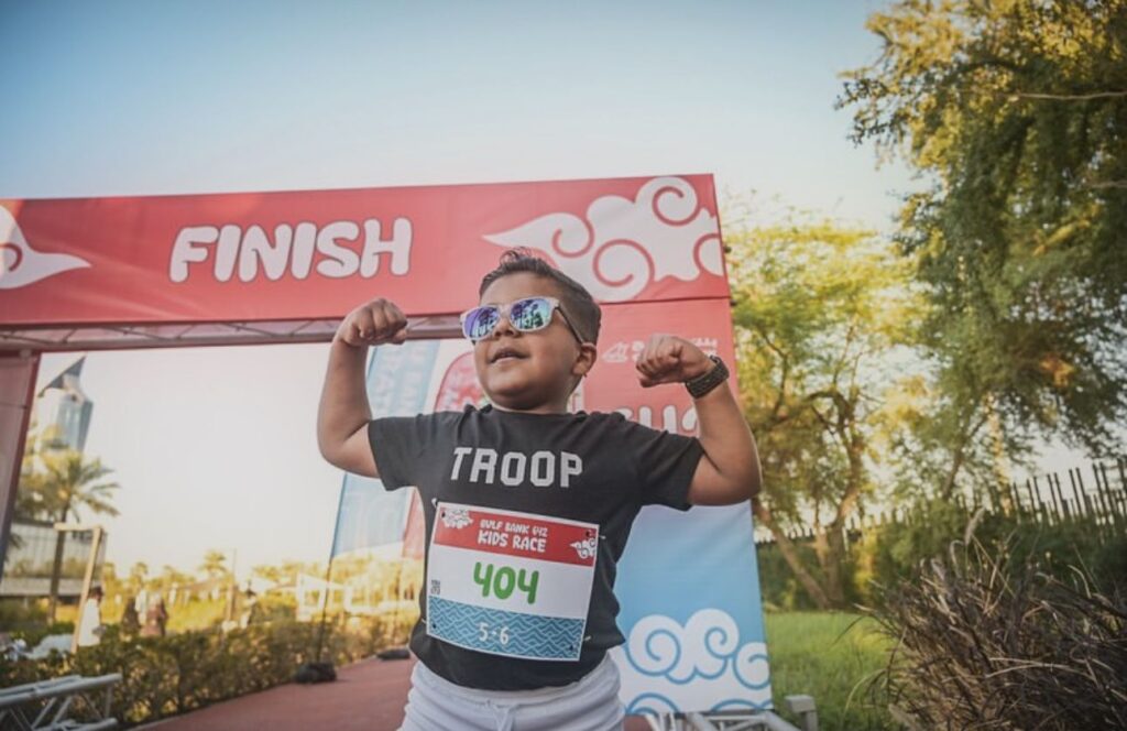 A kid who reached the finish line at the 
Gulf bank 642 marathon