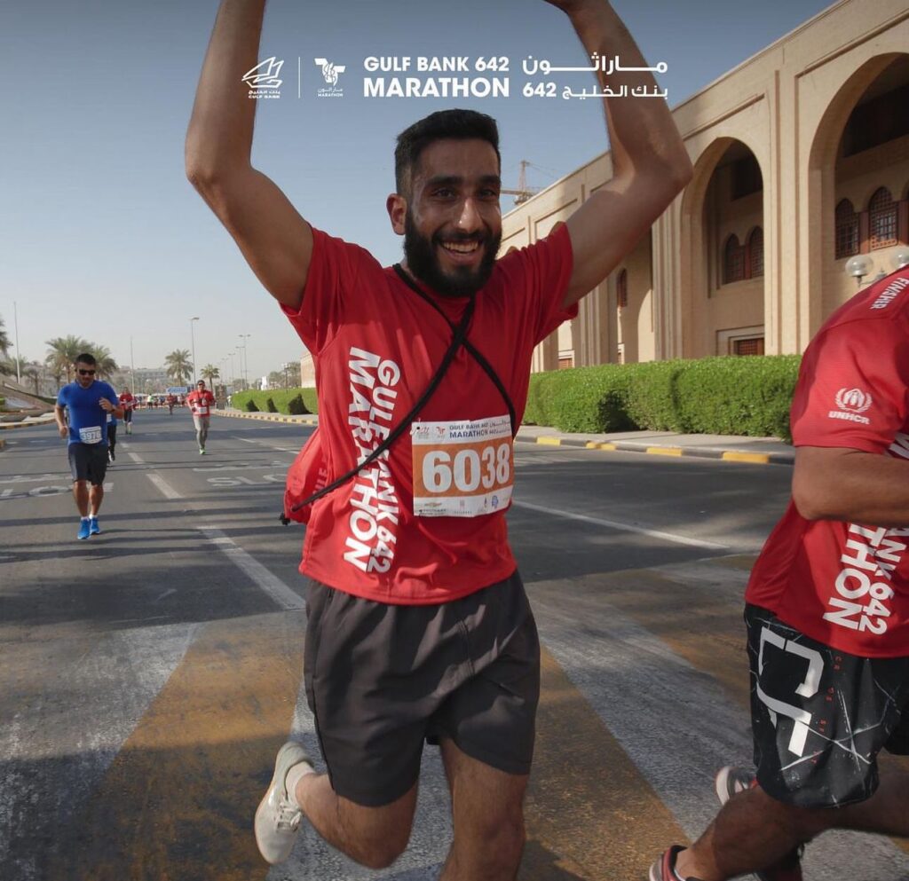 A participant running and enjoying the Gulf Bank 642 Marathon