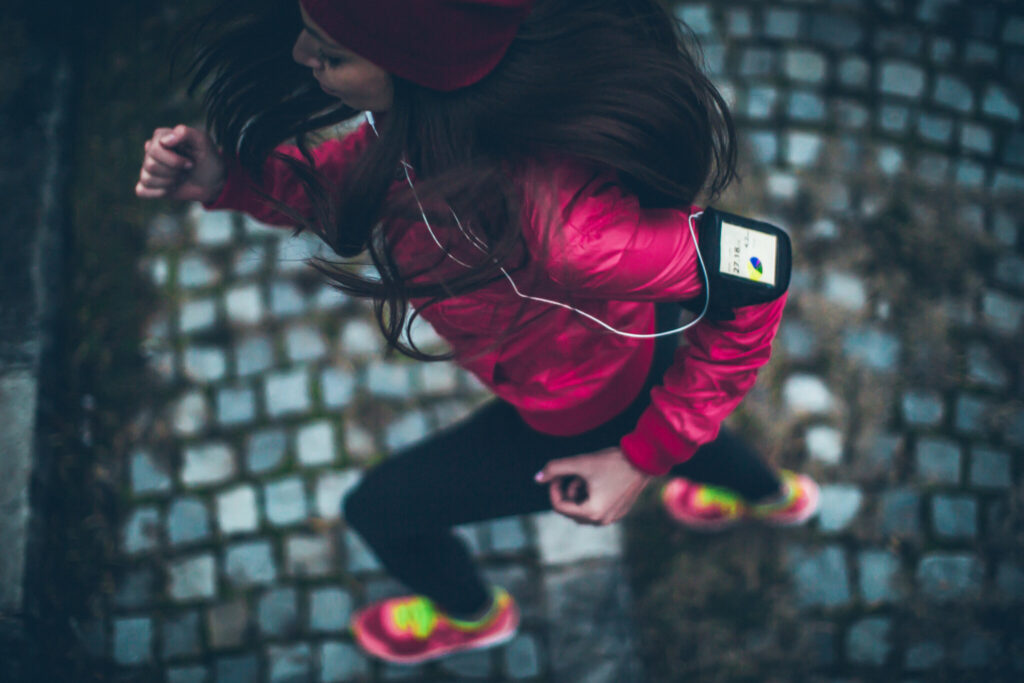 A woman running while listening to music