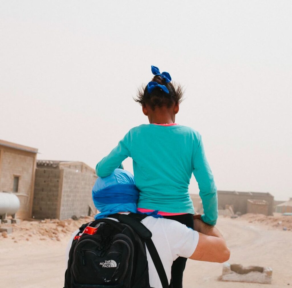 A runner carrying a refugee 