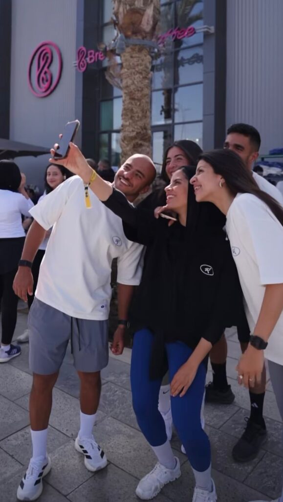 a group of people enjoying the "morning rave event" and taking a selfie